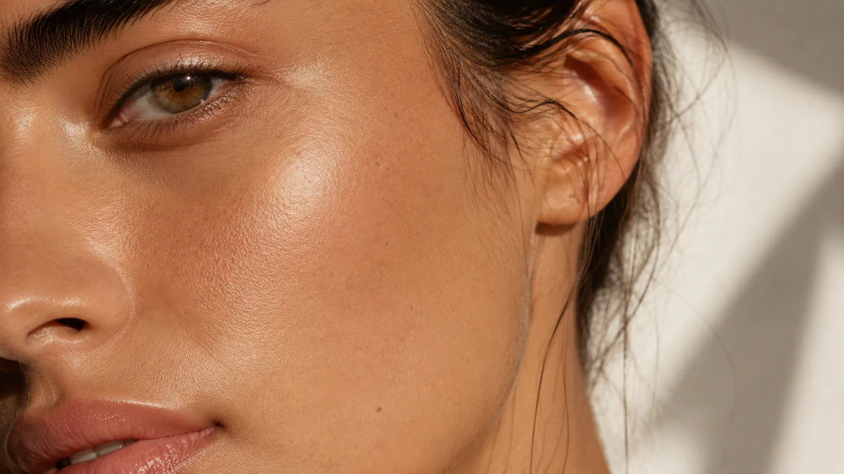 Macro detail of smooth, luminous, healthy-looking skin — the skin quality result retinol alternatives aim to support
